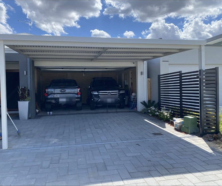 Double flat roof carport with privacy screen sheltering two vehicles in Perth, WA