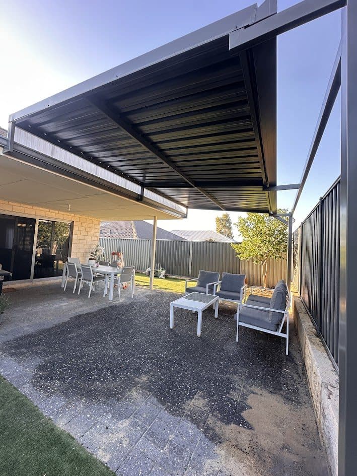 Skillion patio with dark underside over an outdoor dining and lounge area in Perth, WA
